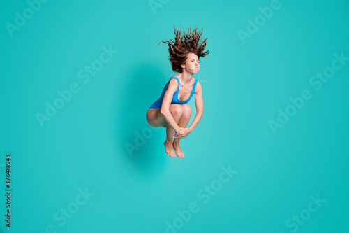 Photographie Photo of slim thin slender girl rest relax resort jump springboard dive water po