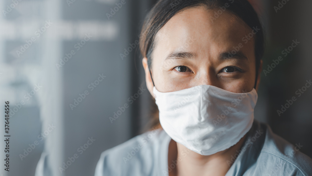 Woman wearing face mask during coronavirus COVID-19 outbreak. Virus spread flu prevention carantine. Girl in a facemask in coffee shop. Prevent air pollution and pm2.5 dust. Woman wearing face mask during coronavirus COVID-19 outbreak. Virus spread flu prevention carantine. Girl in a facemask in coffee shop. Prevent air pollution and pm2.5 dust.