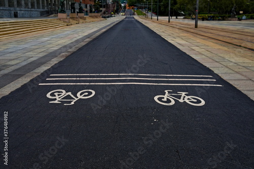 Urban bike path with icons on the asphalt.