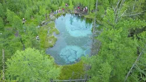 geyser lake in Altai with tourists drone view