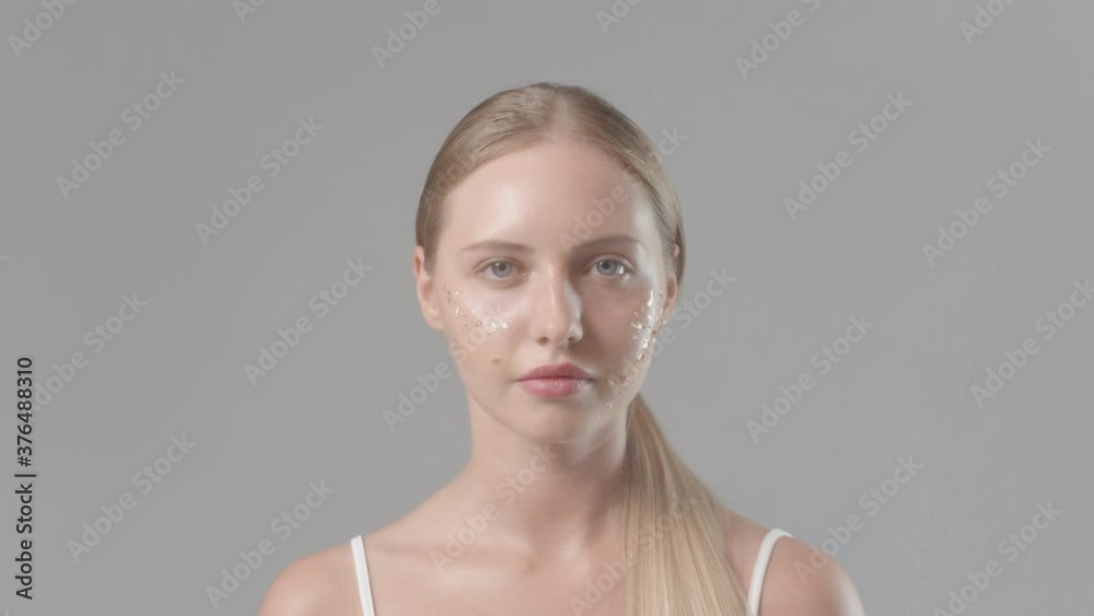 Beautiful woman face close up studio on white Beautiful woman face close up studio on white