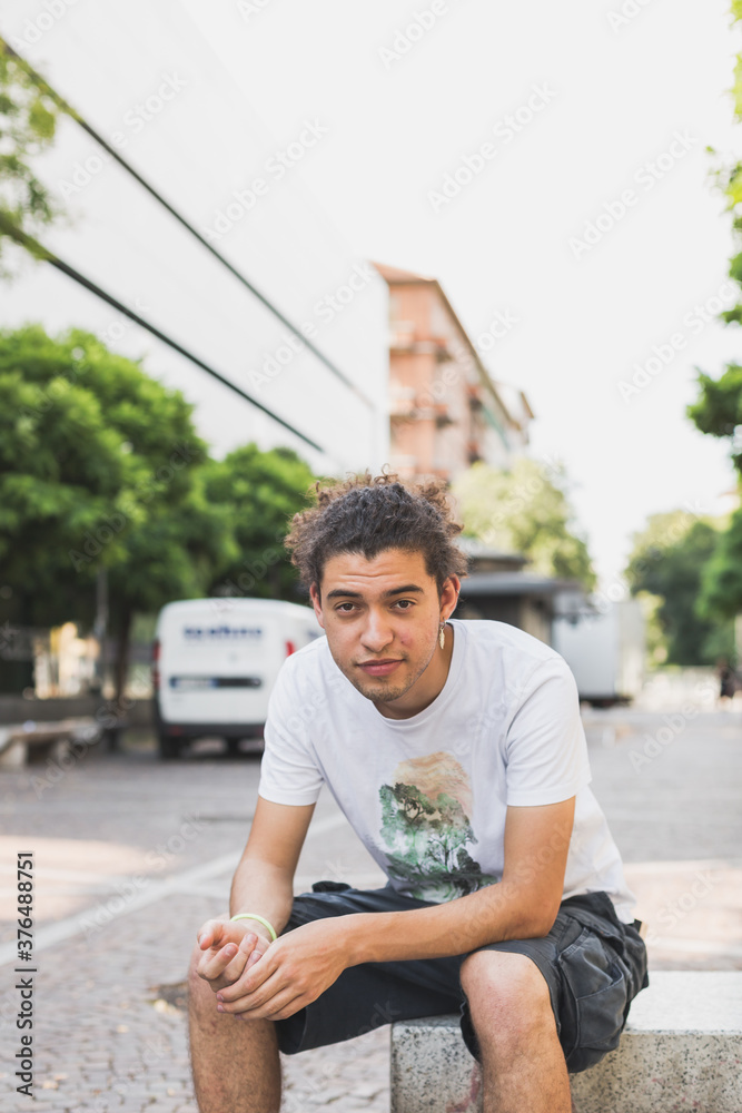 Fototapeta premium Young man posing in the city streets