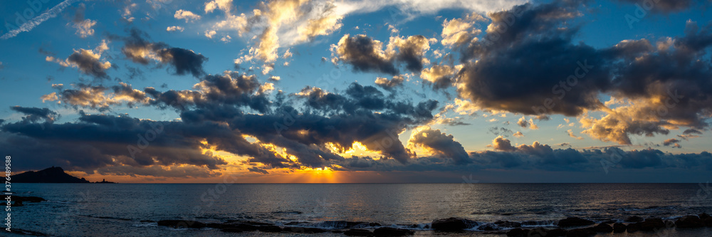 amazing panorama of sunrise or sunset above the seashore and horizon amazing panorama of sunrise or sunset above the seashore and horizon