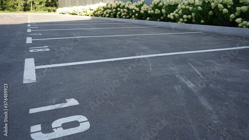 Wallpaper Mural Close-up of a white paint number marking in a parking lot. Empty parking lot, Parking lot with white mark, Open parking in public park. Number 19. Torontodigital.ca