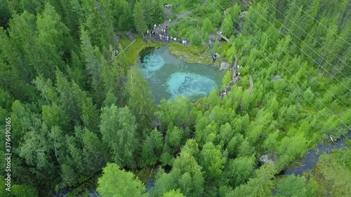 geyser lake in Altai with tourists drone view