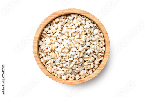Flat lay (top view) of Job's tears ( Adlay millet) in wooden bowl isolated on white background. Clipping path.
