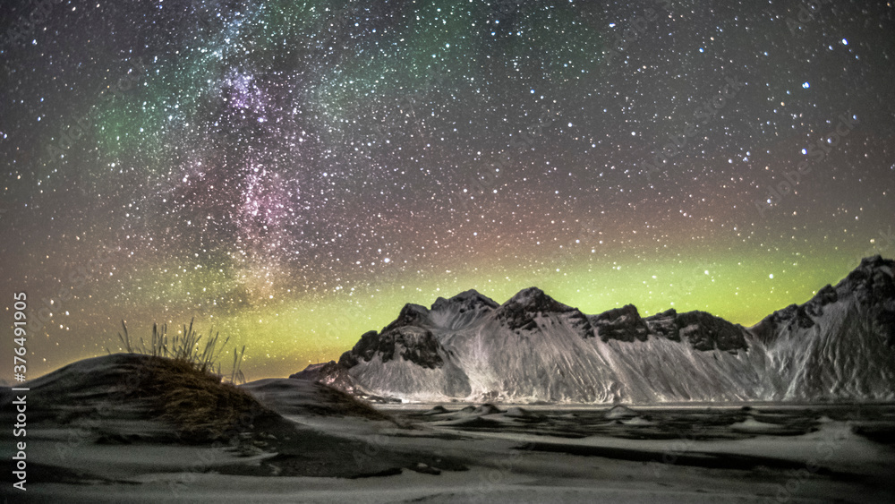night sky mountain with aurora borealis