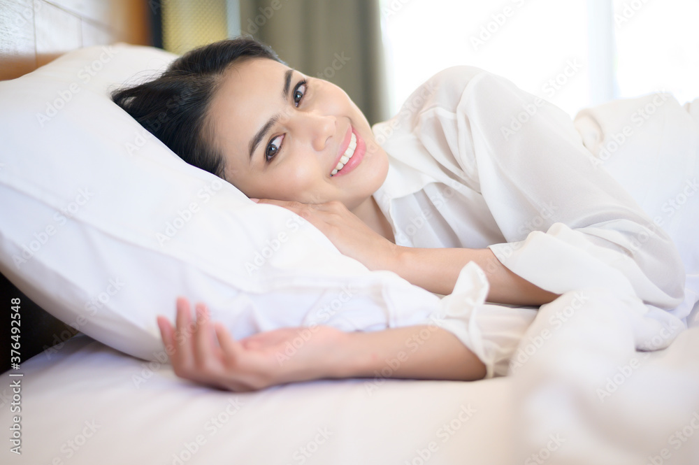 Young beautiful woman sleeping in her bed at home Young beautiful woman sleeping in her bed at home