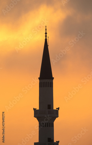 Minaret at sunrise a photograph taken from Busiateen coast  Bahrain