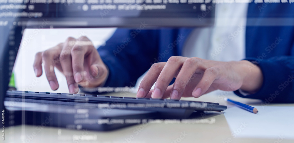 close up programmer man hand typing on keyboard at computer desktop for input coding language to software for fix bug and defect of system in operation room , development of technology concept close up programmer man hand typing on keyboard at computer desktop for input coding language to software for fix bug and defect of system in operation room , development of technology concept