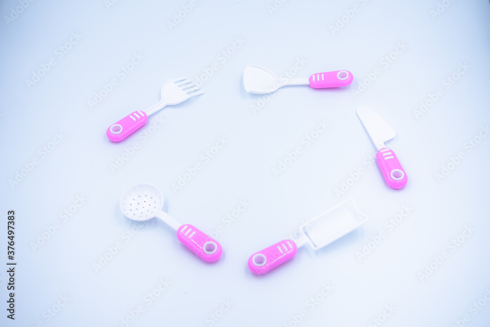 Children's pink plastic cooker for cooking on a white background Children's pink plastic cooker for cooking on a white background