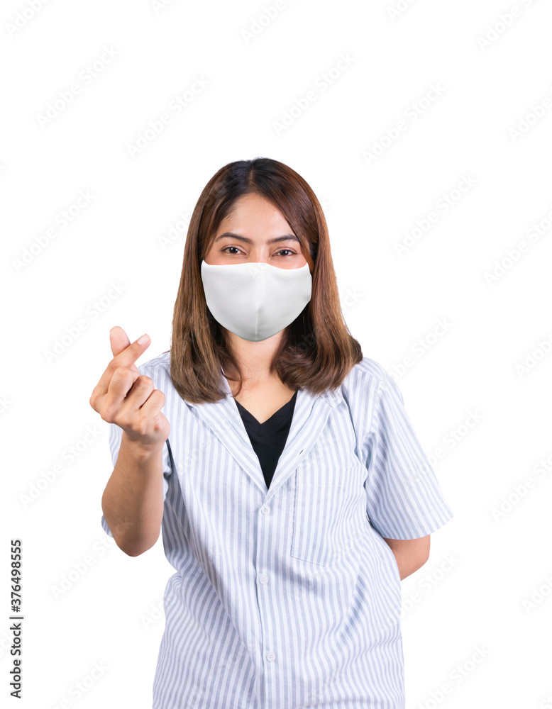 woman showing mini heart sign and wearing fabric mask safety Covid-19 or coronavirus on white background woman showing mini heart sign and wearing fabric mask safety Covid-19 or coronavirus on white background