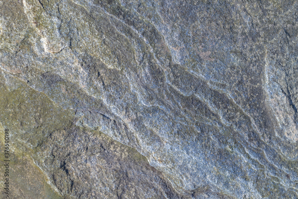Naklejka premium Top view. Rough, uneven, irregular granite stone surface. Natural textured relief grey background.