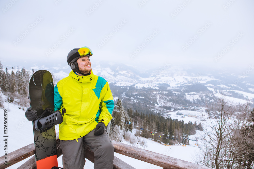 man looking at free space in ski snowboard outfit man looking at free space in ski snowboard outfit