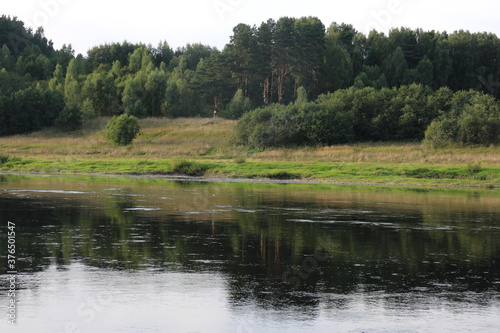 View of the river in the countryside at sunset