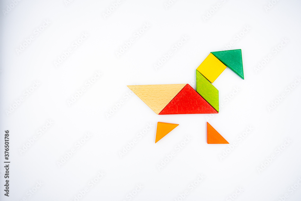 Color wood tangram puzzle in Duck shape on white background Color wood tangram puzzle in Duck shape on white background