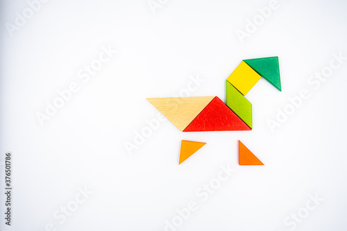 Color wood tangram puzzle in Duck shape on white background Free Download Color wood tangram puzzle in Duck shape on white background - GFXLoad