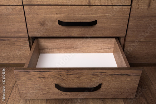 Empty open wooden drawer. Storage box.