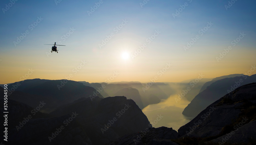 Helicopter going in for landing with the wonderful Lysefjord in the background, Norway