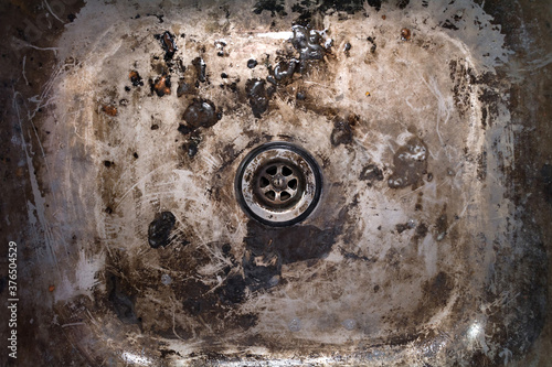 Very dirty iron sink. Real rust texture.