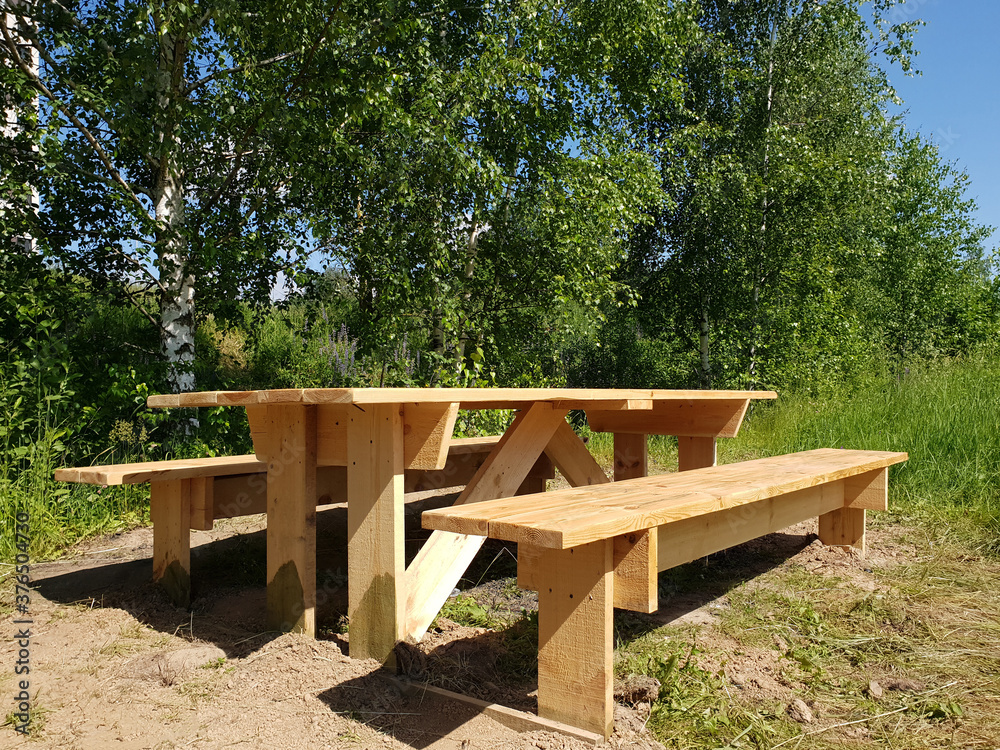 Wooden table and benches for outdoor recreation