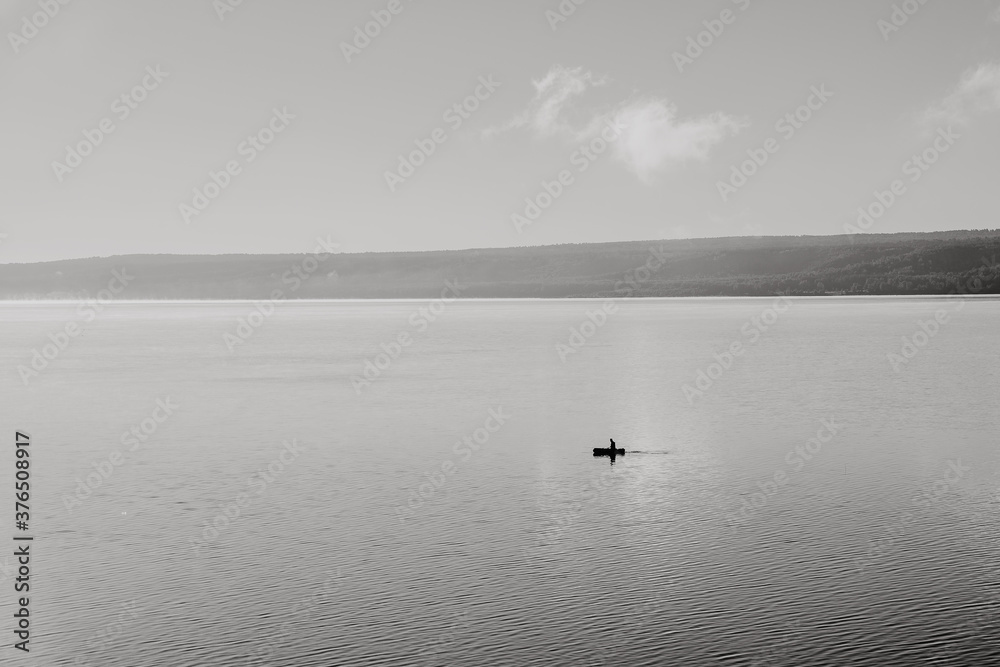 fog creeps over the surface of the water, sunrise over the lake, early morning. nature of Russia, lake Kandrykul, southern Urals