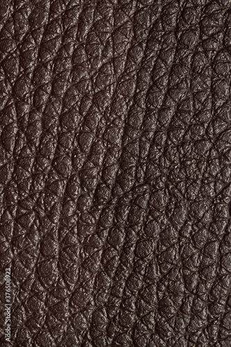 Artificial brown leather fabric surface with triangle pattern texture for macro wallpaper or background