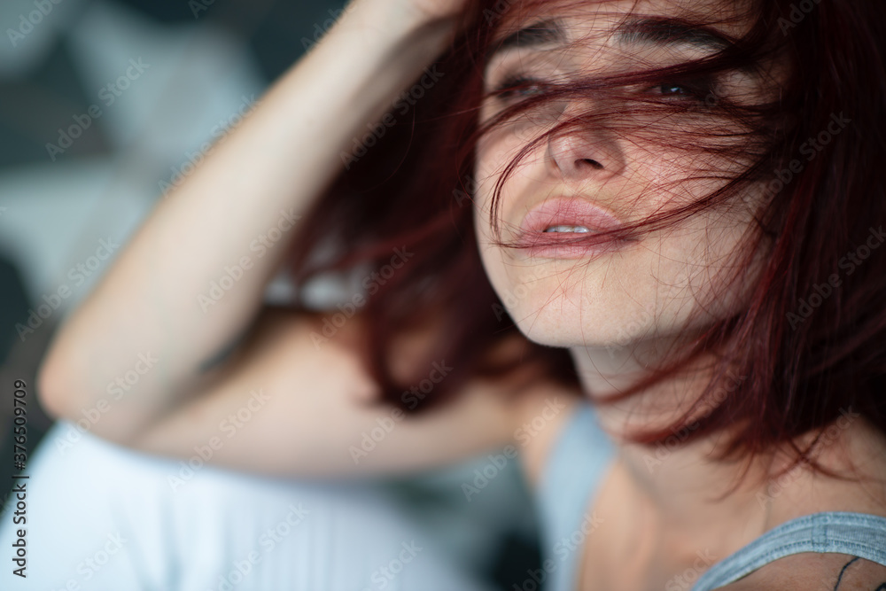 Beautiful young stylish ginger woman with freckles. Fashion portrait of charming girl wearing casual clothes posing at home. Passion Beautiful young stylish ginger woman with freckles. Fashion portrait of charming girl wearing casual clothes posing at home. Passion