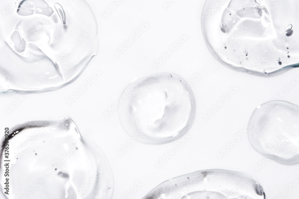 Transparent hyaluronic acid gel drops on a white background. Transparent hyaluronic acid gel drops on a white background.