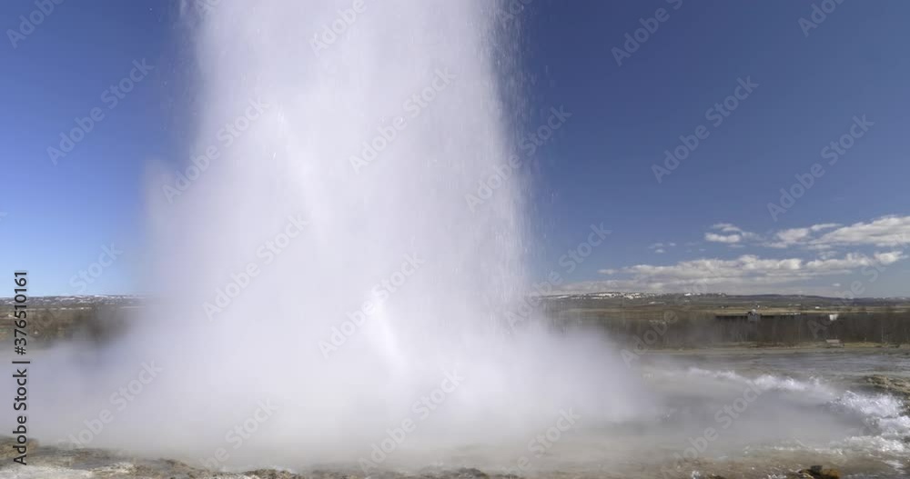 Geyser double eruption in Geysir national park Iceland sunny day