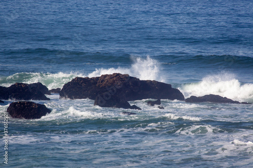 Ocean Waves crashing on rocks at the shore