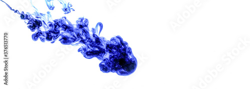 Blue ink injected into water from syringe, colour mixing with water creating abstract shapes, banner with space for text right side