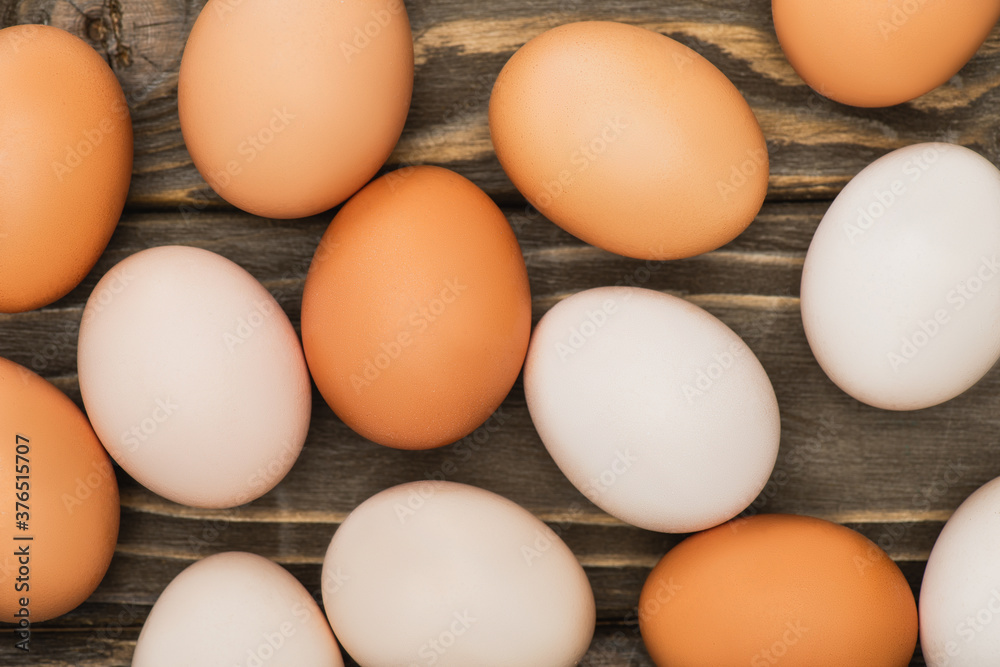top view of fresh chicken eggs on wooden surface top view of fresh chicken eggs on wooden surface