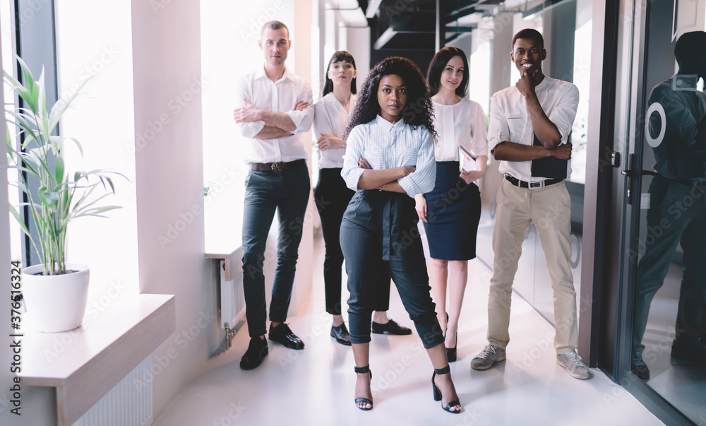 Fototapeta premium Confident business group standing in hall