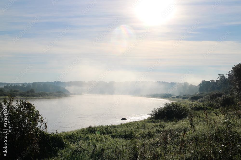View of the misty river from the morning in summer
