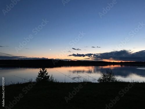 sunset over the lake. night fishing