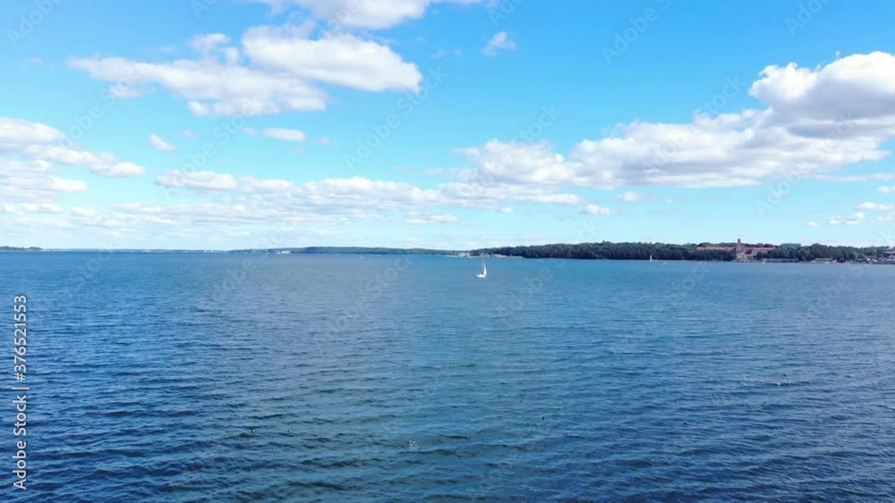drone view near flensburg fjord in germany, clear and calm sea water. sunny summer holiday sky with beautiful clouds. amazing colorful scenery. holiday travel concept drone view near flensburg fjord in germany, clear and calm sea water. sunny summer holiday sky with beautiful clouds. amazing colorful scenery. holiday travel concept