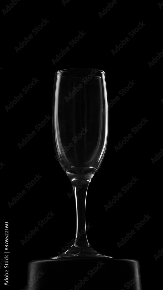 Empty wine glass om black background