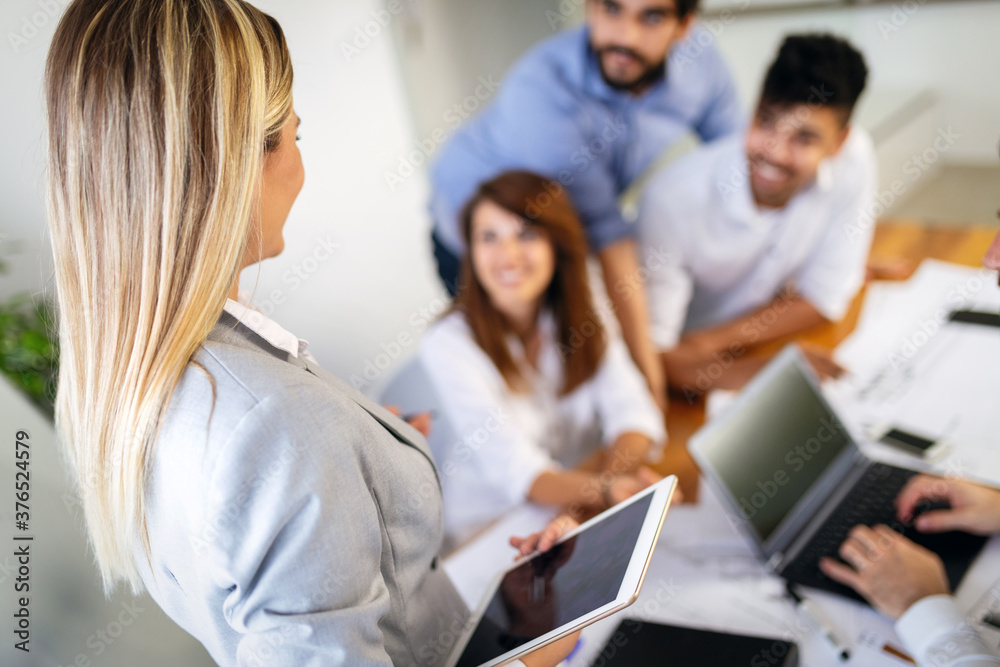 Group of business people meeting in office, sharing their ideas. Group of business people meeting in office, sharing their ideas.