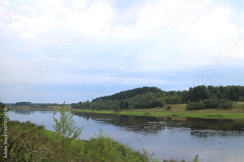 Fototapeta Naklejka Na Ścianę i Meble -  View of the river in the countryside at sunset