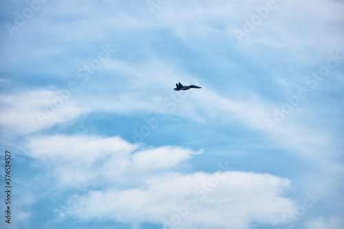 Fighter aircrafts taking off in the blue sky. © Sergei