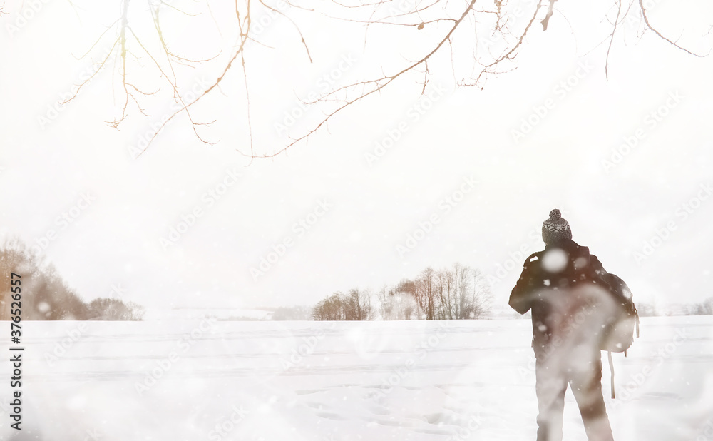 A man on a walk. Winter landscape. Tourist in winter journey. A man on a walk. Winter landscape. Tourist in winter journey.