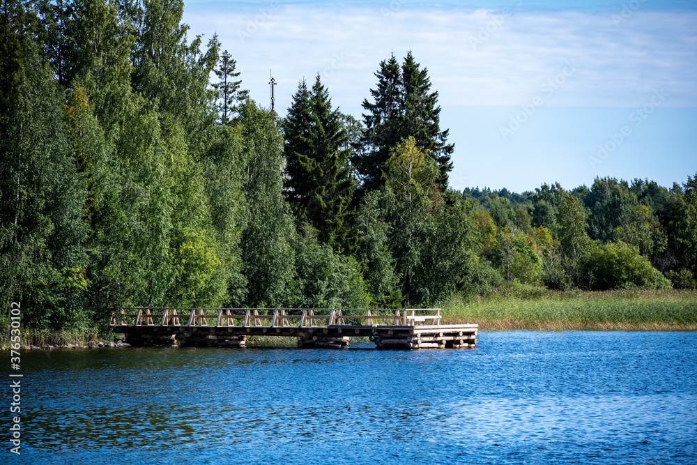 natural landscape of a large lake with boats and navigation signs natural landscape of a large lake with boats and navigation signs