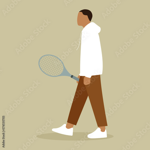 
A man goes with a tennis racket in his hand