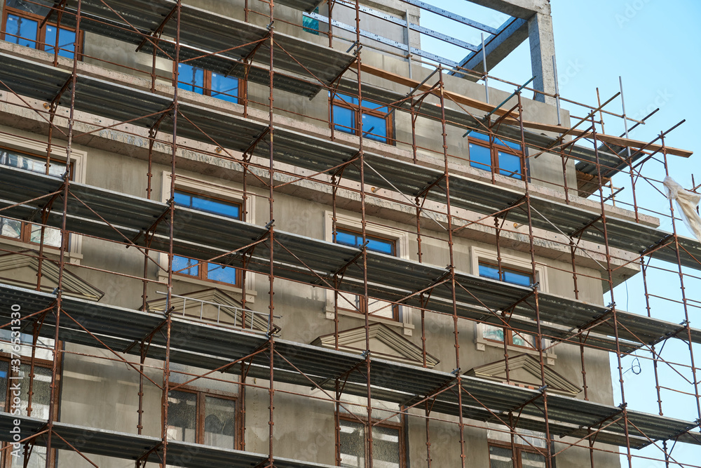 scaffolding and new building as background