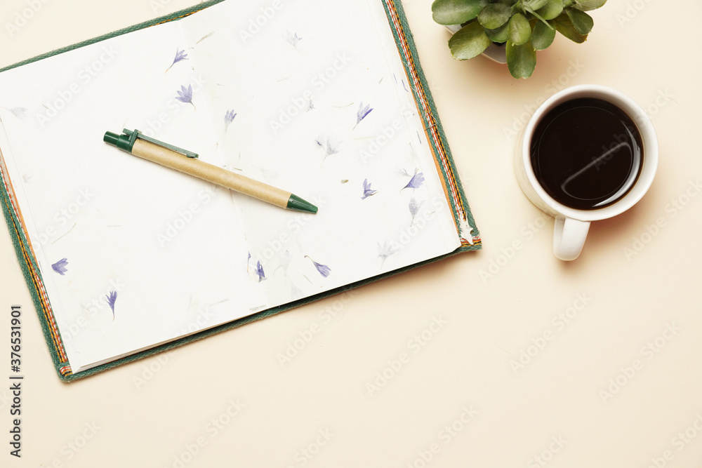 top view of workspace with coffee open notebook and pen. flat lay top view of workspace with coffee open notebook and pen. flat lay