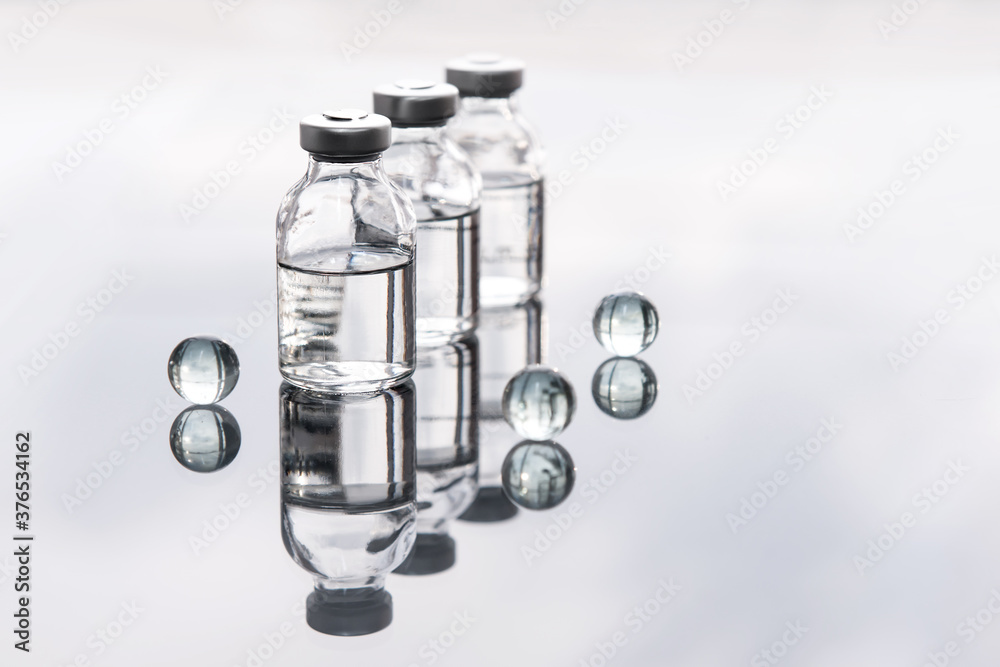 Set of transparent medical bottles and bottles with liquid with different transparent balls. Set of transparent medical bottles and bottles with liquid with different transparent balls.