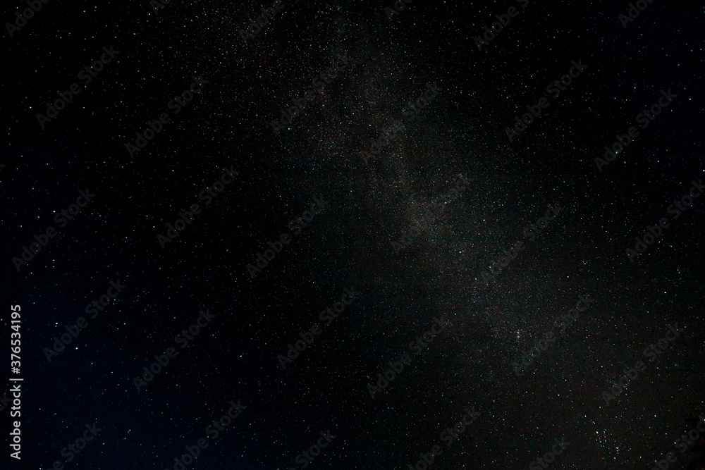 Starry sky and Summer meadow with trees. Summer night. The milky way over the field. Starry sky and Summer meadow with trees. Summer night. The milky way over the field.
