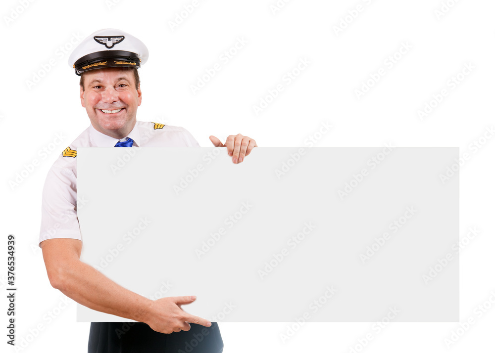 A smiling pilot hold empty board, isolated on white background. Captain of air plane with large blank billboard. A smiling pilot hold empty board, isolated on white background. Captain of air plane with large blank billboard.