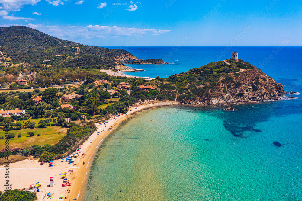 Torre di Chia view from flying drone. Acropoli di Bithia with Torre di Chia tower on background. Aerial view of Sardinia island, Italy, Europe. Panorama Of Chia Coast, Sardinia, Italy.